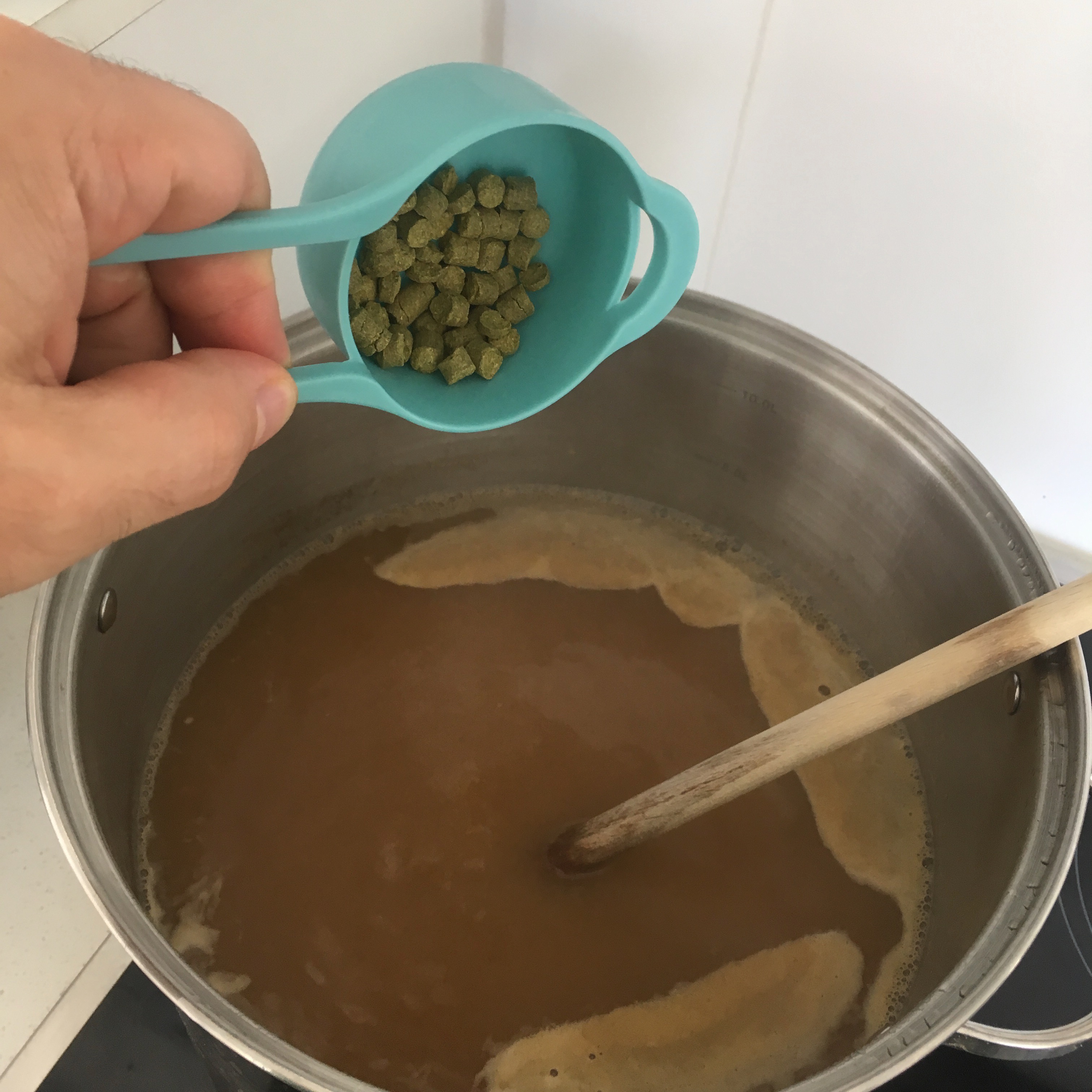 Add the hop pellets at the desired times. In this instance I added a portion of the hops every 10 minutes